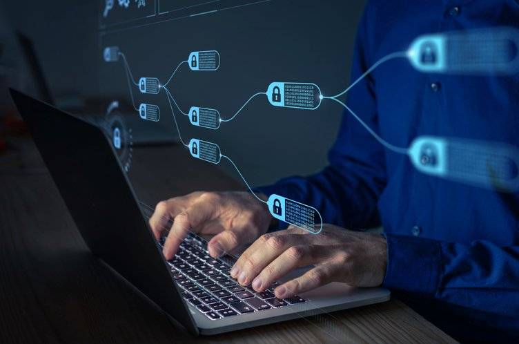 Blockchain graphic over professional using laptop
